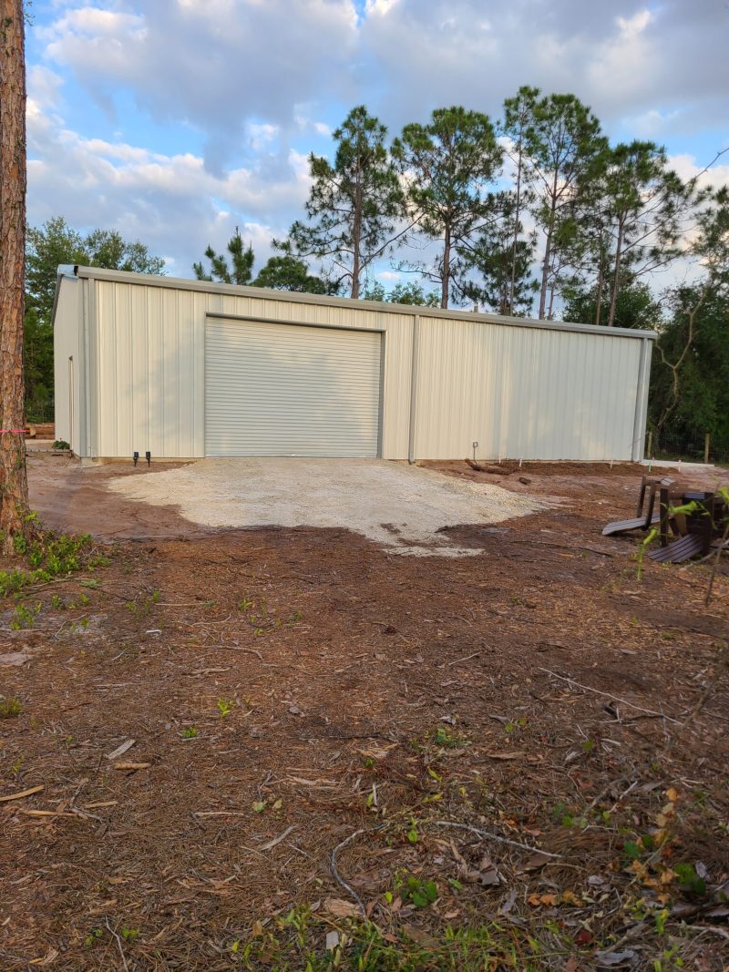 White Steel Garage in Wooded Setting