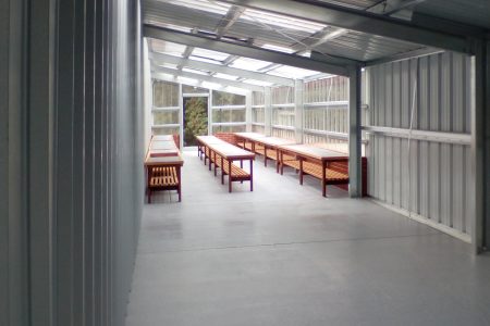 Interior of Steel Workshop with Transparent Wall Panels Steel Commander Corp | 40+ Years Expertise | American-Made Steel Buildings