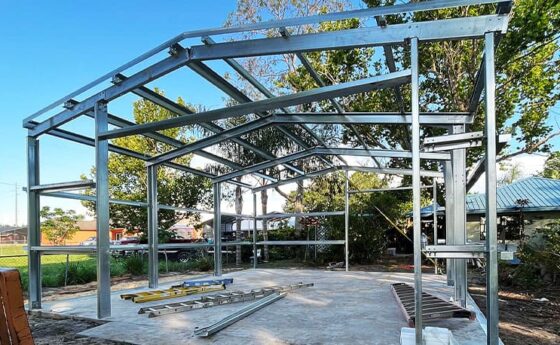 Custom steel building frame under construction by Steel Commander Corp. Steel Building Kits for Sale — Commercial, Garage & Residential