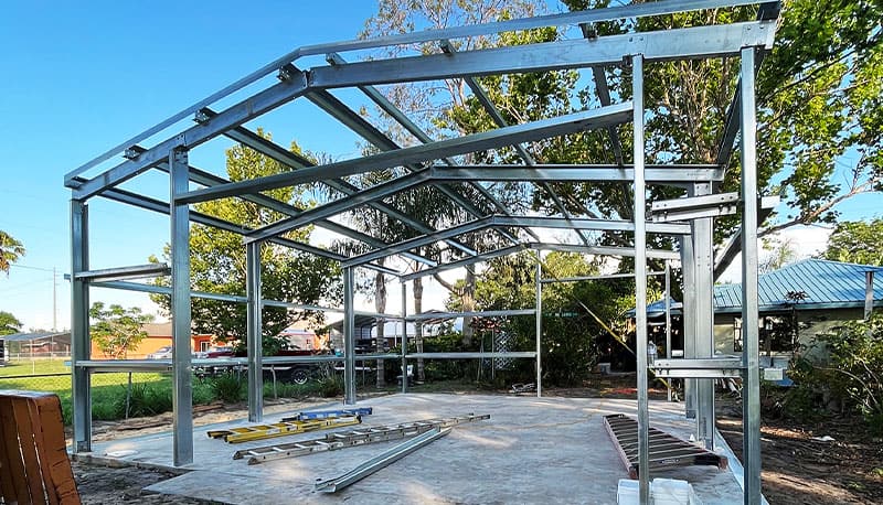 Custom steel building frame under construction by Steel Commander Corp. Steel Building Kits for Sale — Commercial, Garage & Residential