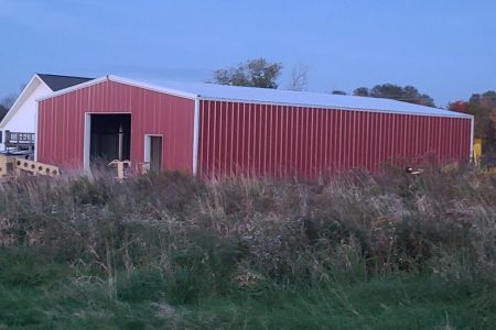 Red Steel Building with White Roof