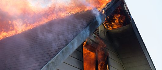 Pitched Roof of Traditional Home on Fire