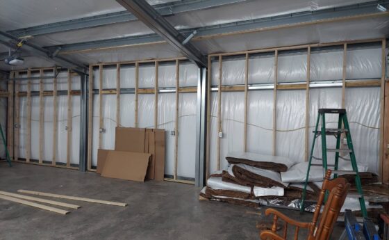 Steel garage kit being assembled in Arizona workshop. Steel Commander Corp — American prefab steel building manufacturer, Boca Raton, Florida