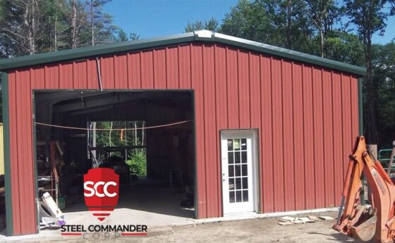 Steel building with red metal exterior, ideal for commercial or storage use. Steel Commander Corp logo — American prefab steel building manufacturer, Boca Raton, Florida
