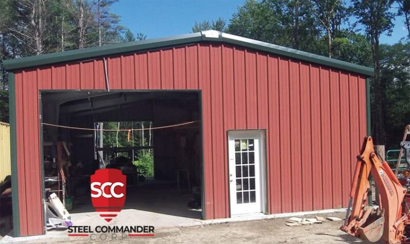 Steel building with red metal exterior, ideal for commercial or storage use. Steel Commander Corp logo — American prefab steel building manufacturer, Boca Raton, Florida