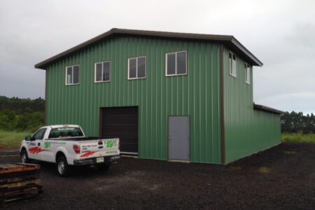 Green Steel Building with Brown Pitched Roof