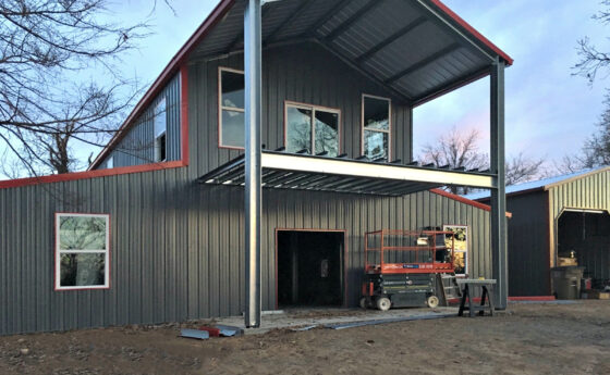large grey and red steel building | steel building durability