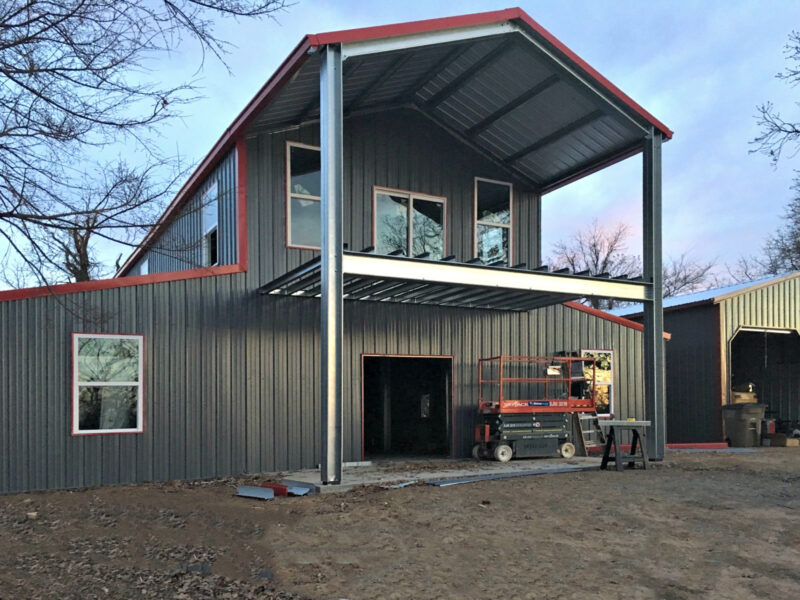 Large Two-Story Grey and Red Steel Home