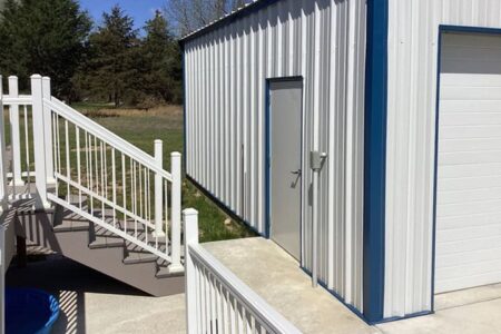 Side View of White and Blue Steel Garage Steel Commander Corp | 40+ Years Expertise | American-Made Steel Buildings