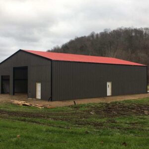 This steel warehouse, sized at 60x80, is placed on a piece of farm land.